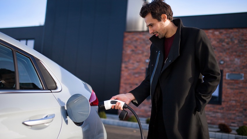 learner driver charging electric car