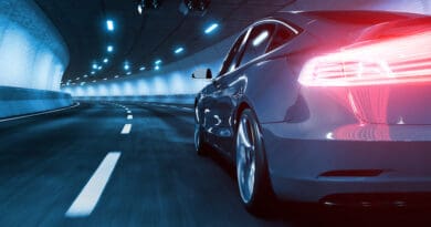 Modern Electric car rides through tunnel