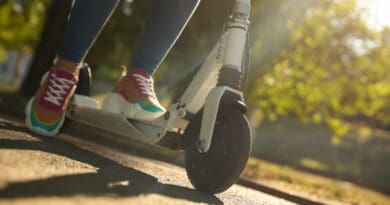 Woman riding electric scooter