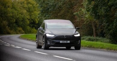 Tesla Model X driving through British countryside