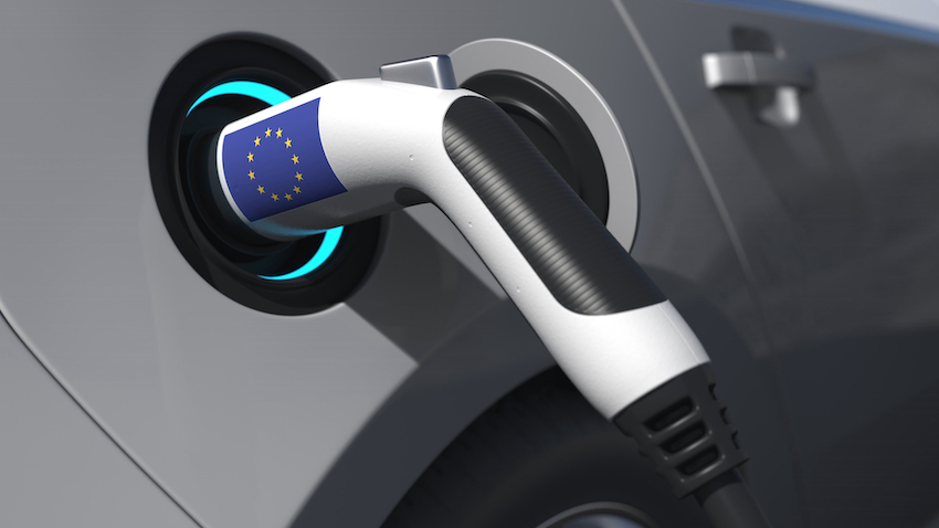 Charging plug in an electric car with flag of the european union