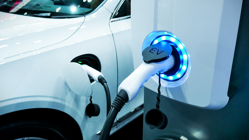 Power supply connect to electric vehicle for charge to the battery. Charging technology industry transport which are the futuristic of the Automobile. EV fuel Plug in hybrid car.