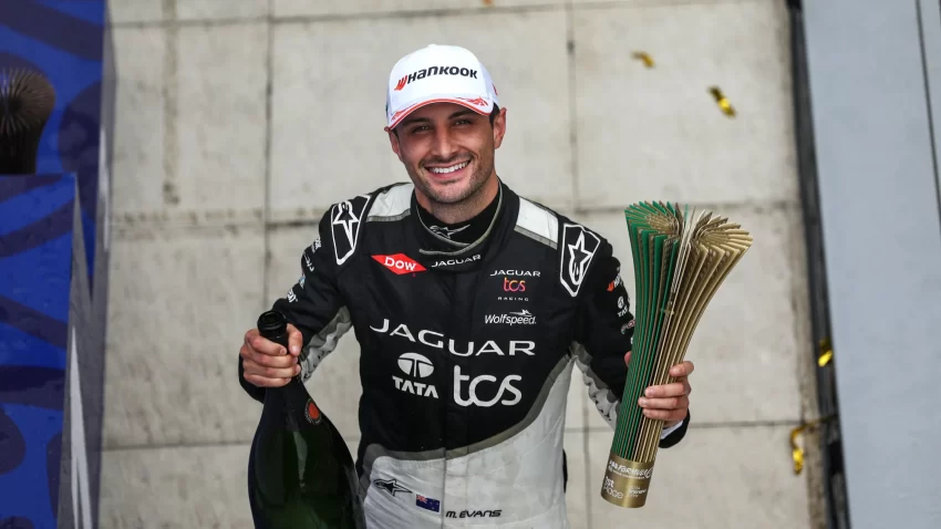 Jaguar TCS Racing's Mitch Evans executed a stunning final lap manoeuvre to clinch victory in the Shanghai E-Prix Round 11, overtaking Porsche's Pascal Wehrlein in a thrilling finish.