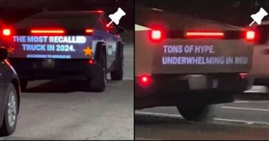 anti-tesla-messages-projected-on-tesla-cybertruck-tailgate-by-cybertruck-hunters