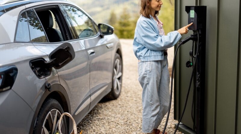 best-ev-tariffs-woman-charging-electric-car-at-home
