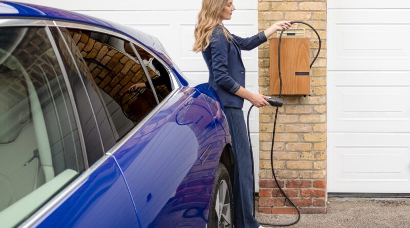 home-charger-installation-driver-plugging-ev-into-wallbox