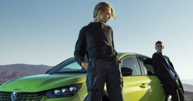 two young men with peugeot e-208 to illustrate driver ignorance of evs