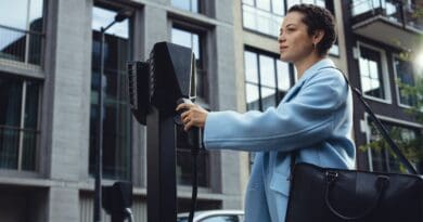 driver plugging an EV into Easee charger