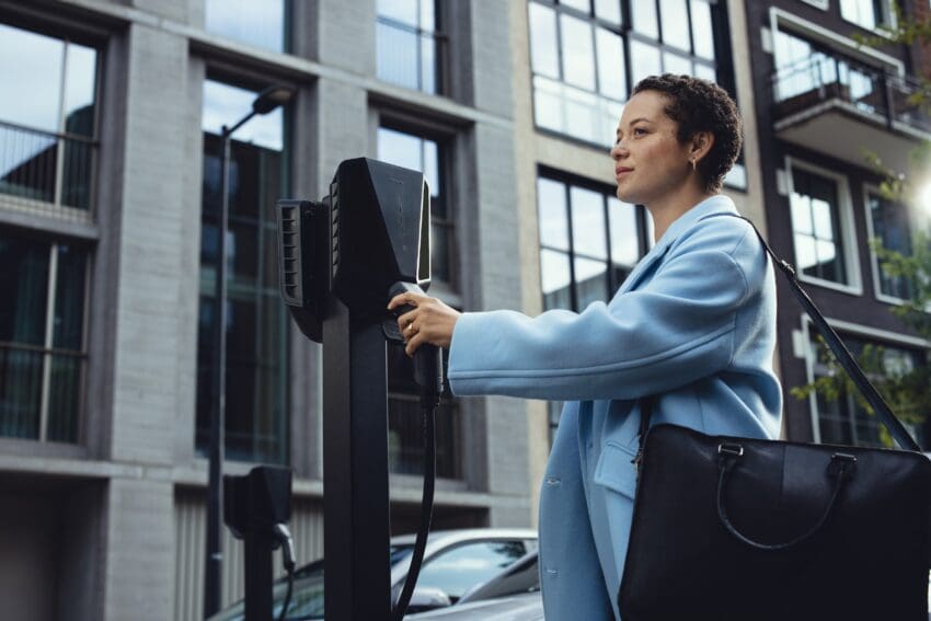driver plugging an EV into Easee charger