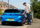 driver charging Vauxhall Astra to illustrate EV myths report from char.gy