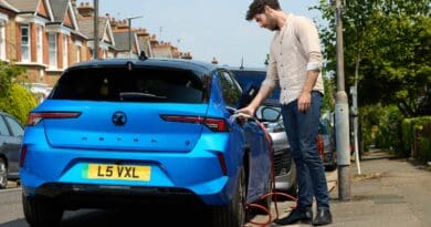 driver charging Vauxhall Astra to illustrate EV myths report from char.gy