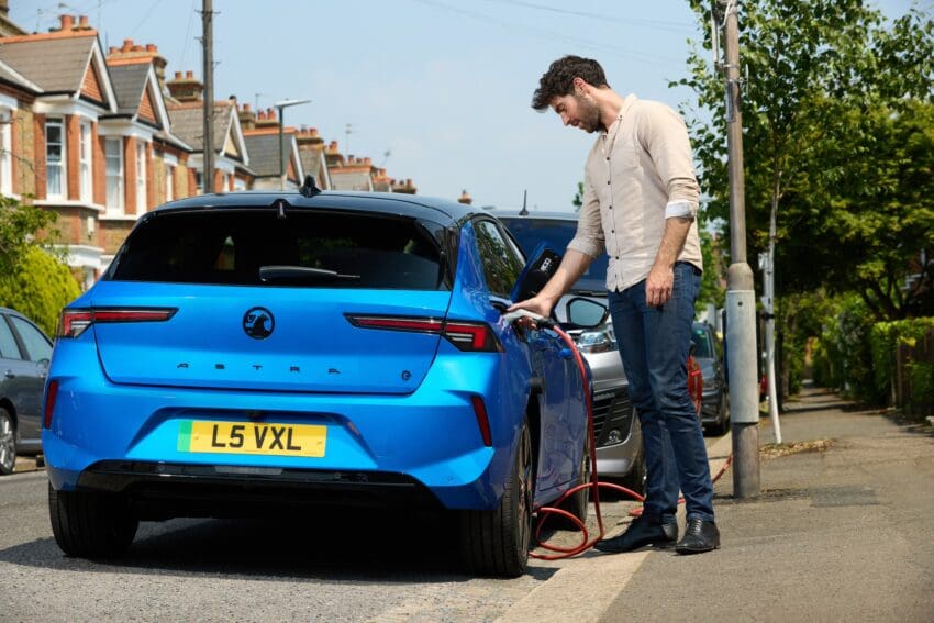 driver charging Vauxhall Astra to illustrate EV myths report from char.gy